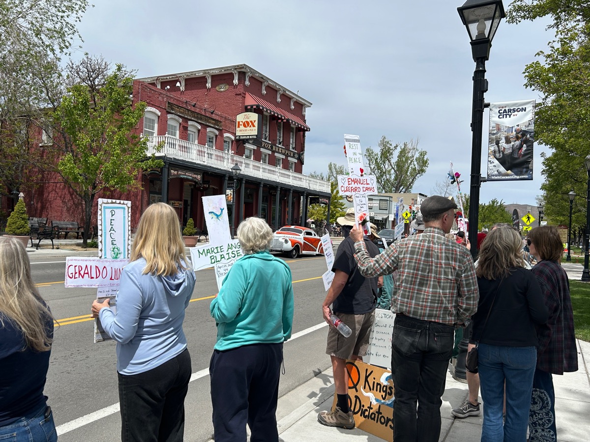 Rally line with memorial signs near Fox Brew Pub