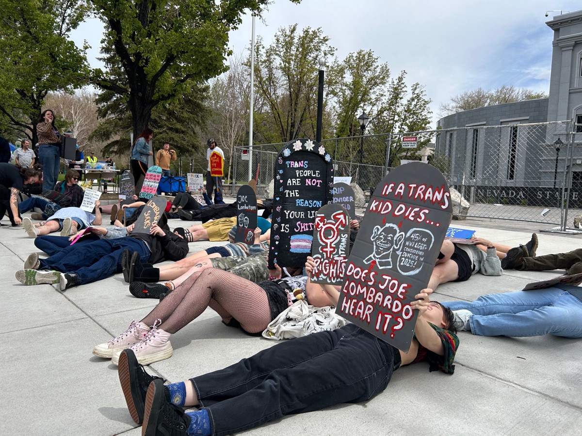 Die-in protest with Trans rights signs at the State Senate