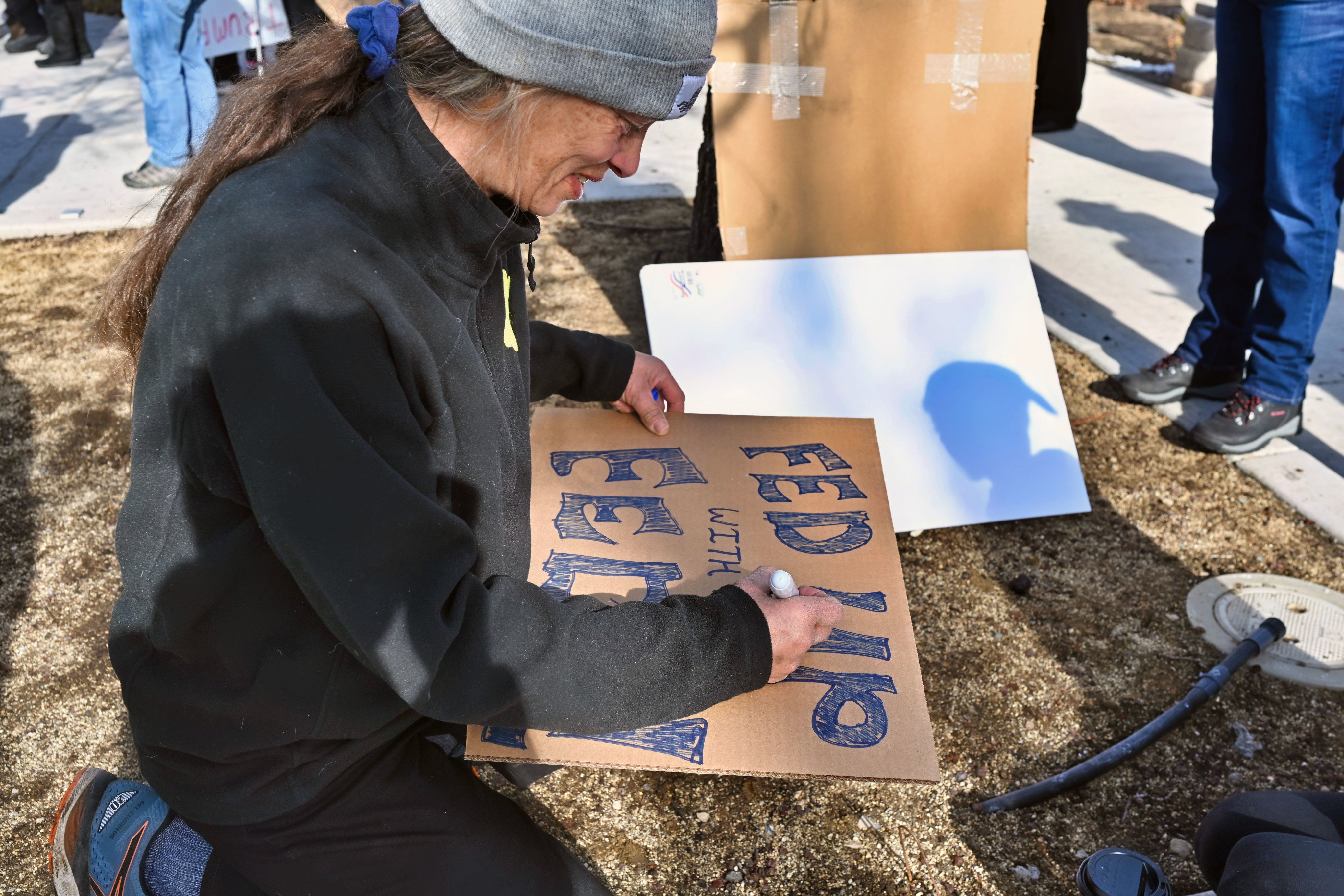 Community member making a sign